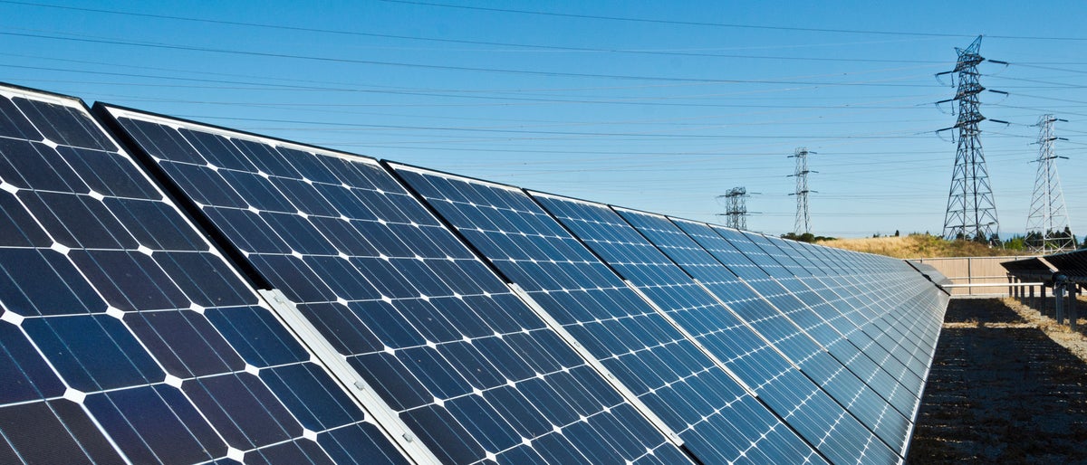 Solar panels feed utility lines at a location in the San Francisco Bay Area.